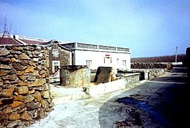 stone walls such as this one constructed of blocks quarried from the coral reefs
					have been protecting these island communities for thousands of years